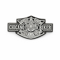 Chicano Biker metal lapel pin with Aztec-inspired design in black and silver, Chicano lowrider cap accessory